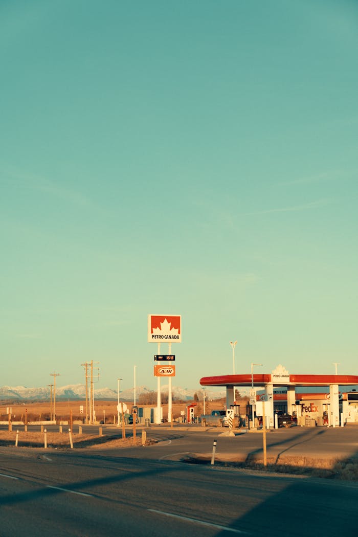 Petro-Canada gas station along a scenic road in Alberta, Canada, during winter.